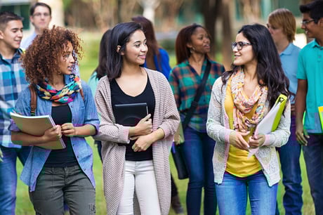College girls talking together on campus